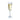 Clear champagne flute filled with white wine on a white background