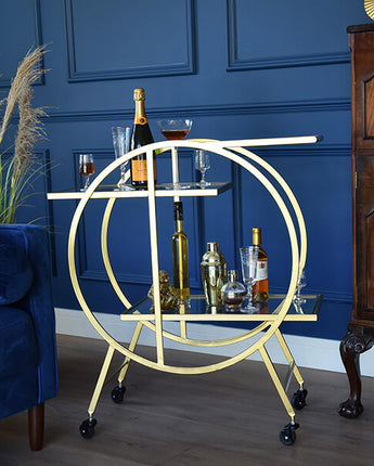 Gold Art Deco Style Round Drinks Trolley with Two Shelves Set On Four Black Wheels