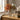 Chrysanthemum autumnal florals in glass vase on a wooden side table