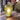 Green ridged glass table lamp on a wooden surface with blurred background
