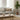 Modern living room with a gray sofa, Rectangular Cream Tassel Cushion, wooden coffee table, and potted plant.