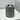 Ribbed grey toothbrush holder on shelf, front view