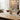 Wine glasses with red wine on a table with a bottle and decor
