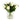 Tulips bouquet featuring cream artificial tulips with green leaves in a clear cylindrical glass vase on a white background