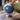 Decorative globe on a wooden surface with a blurred background