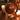 Decorative globe on a table with candles in a warm, cozy setting