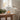 White Star & Moon Wax Melt Burner  with a candle on a wooden table in a cozy living room.