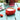 Strawberry-shaped container with a candle on a table with strawberry decorations.