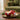 bauble candle: lifestyle view 1 of the santa ho ho ho bauble candle styled in a festive home setting
