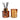 An amber glass reed diffuser bottle with black reeds and a gold cap, shown next to a matching amber glass candle gift set