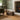 A dark brown wooden crate with heart-shaped cutout handles sits on a living room floor