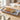 Slices of bread on a decorative ceramic plate with a blue floral pattern on a wooden table.