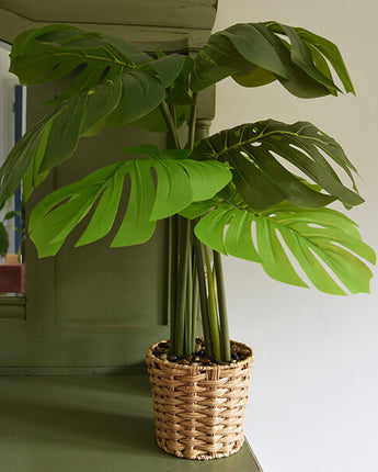 Lifelike Green Leaves in Elegant Beige Wicker Pot