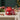 christmas candle: lifestyle view 1 of the ho ho ho lidded candle jar in spiced apple cinnamon styled in a festive home setting