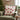 christmas cushion: lifestyle view 1 of the 45cm red and white embroidered santa hat cushion styled in a festive home setting