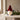 christmas gnome: lifestyle view 2 of the 25cm standing paper gonk decoration styled in a festive home setting