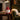 christmas mug: lifestyle view 2 of the red santa mug with lid styled in a festive home setting