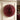 Christmas Tree Decoration red paper spiral Christmas tree decoration with an open folded pattern, styled in a home setting