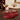 Coaster set set of four red beaded coasters, styled in a home setting