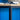 Close-up detail of a console table corner showing the wood top and black metal frame joint.