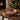 Large tray large gold-coloured metal tray with fig and pomegranate artwork, styled in a home setting