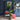 Lifelike Tall Green Strelitzia in Sleek Black Pot