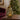 Mini lamp green pear-shaped glass mini lamp with gold-coloured stalk, styled in a home setting alternate view 2