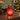 Mini lamp red pear-shaped glass mini lamp with gold-coloured stalk, styled in a home setting