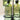 Two green glass bottles labeled 'Oil' and 'Vinegar' on a stand.