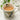 Mug with floral design filled with a beverage on a white surface