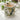Mug with olive design filled with a beverage on a white surface