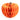 An orange honeycomb paper pumpkin décor piece with a textured, accordion-style pleated body