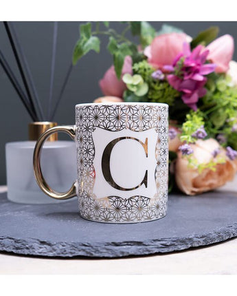 Gold and White Personalised Mug with a Gold Handle and Initial "C" Design