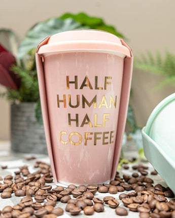 Baby Pink Travel Mug with the Slogan Half Human; Half Coffee"