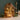 rechargeable lamp: lifestyle view 1 of the Amber rechargeable led glass gingerbread house styled in a festive home setting
