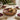 Serving bowl large mango wood serving bowl with enamel fig and pomegranate artwork, styled in a home setting