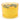 Candle in a transparent yellow container with orange slices and green leaves on a white background