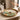 A gold-rimmed round serving tray with a colorful landscape print of traditional East Asian pagodas