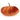 An orange velour pumpkin cushion on a clean white background