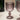Smoky glass goblets on a light surface with a blurred background