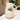 White ceramic pitcher with strawberry design on a kitchen counter