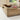Wooden tray on a surface with a blurred background