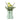 Light green ceramic boot-shaped vase with flowers on a white background