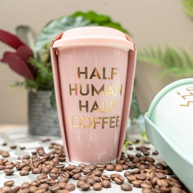 Baby Pink Travel Mug with the Slogan Half Human; Half Coffee"